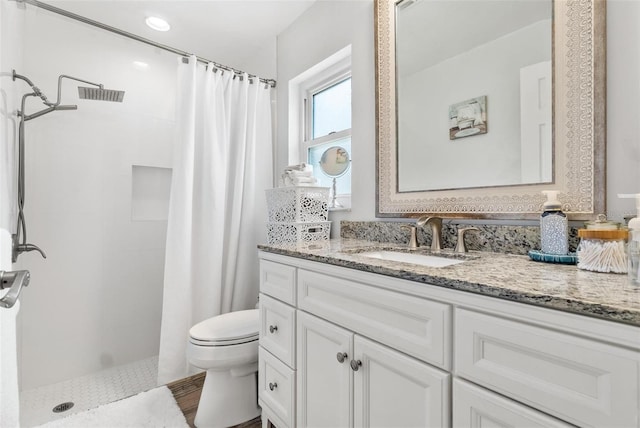 2824 Paddock Dr, Palm Harbor, FL 34684 - bathroom featuring toilet, vanity, and a tile shower