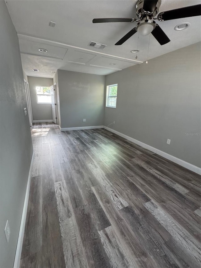 1215 Windsor Cir, Brandon, FL 33510 - spare room with healthy amount of natural light, dark wood-style floors, baseboards, and a ceiling fan