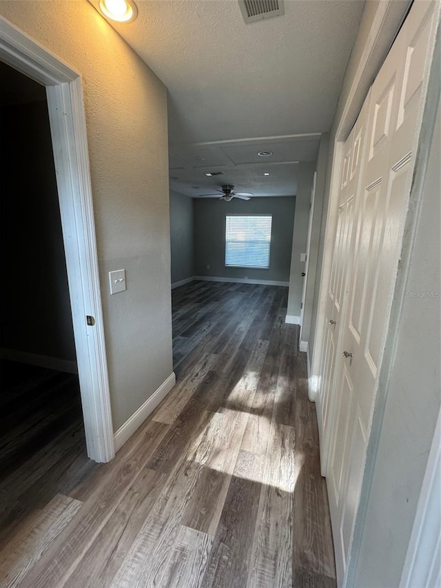 1215 Windsor Cir, Brandon, FL 33510 - hall featuring wood finished floors, baseboards, and attic access