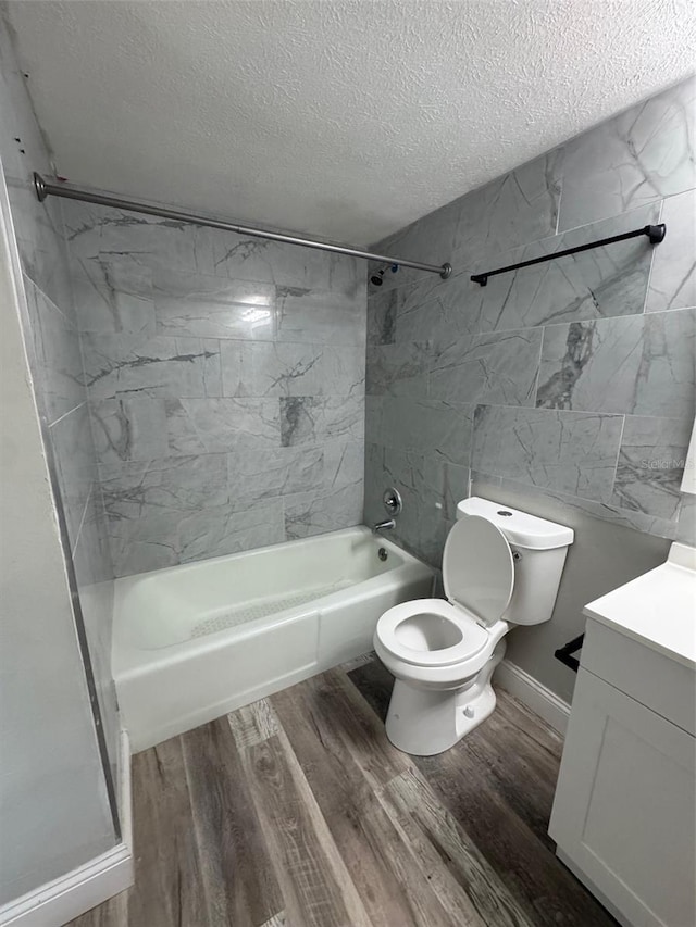 1215 Windsor Cir, Brandon, FL 33510 - full bathroom with a textured ceiling, vanity, toilet, shower / bathtub combination, and wood finished floors