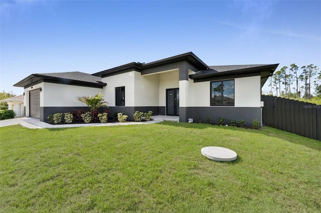 14009 Wenzel Ave, Port Charlotte, FL 33981 - view of front of house with stucco siding, a garage, and a shingled roof