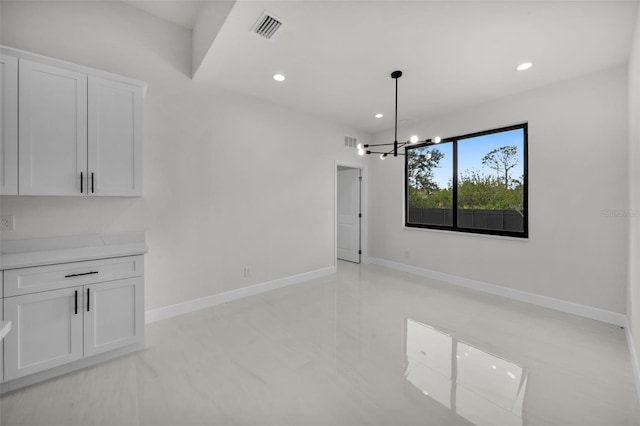 14009 Wenzel Ave, Port Charlotte, FL 33981 - unfurnished room with a chandelier, recessed lighting, and baseboards