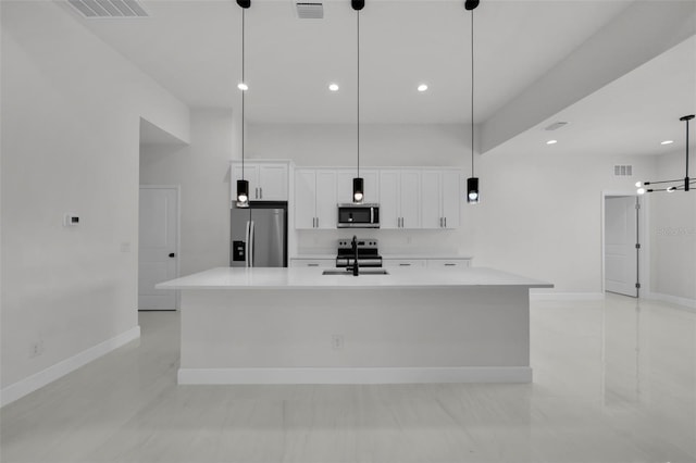 14009 Wenzel Ave, Port Charlotte, FL 33981 - kitchen featuring stainless steel appliances, white cabinets, light countertops, a sink, and baseboards