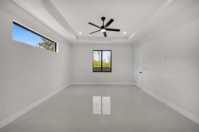 14009 Wenzel Ave, Port Charlotte, FL 33981 - spare room with a ceiling fan, recessed lighting, a raised ceiling, and baseboards