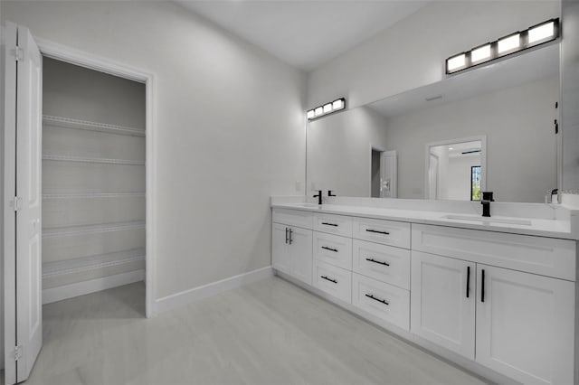 14009 Wenzel Ave, Port Charlotte, FL 33981 - full bathroom featuring double vanity and baseboards