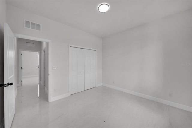 14009 Wenzel Ave, Port Charlotte, FL 33981 - unfurnished bedroom featuring baseboards and a closet