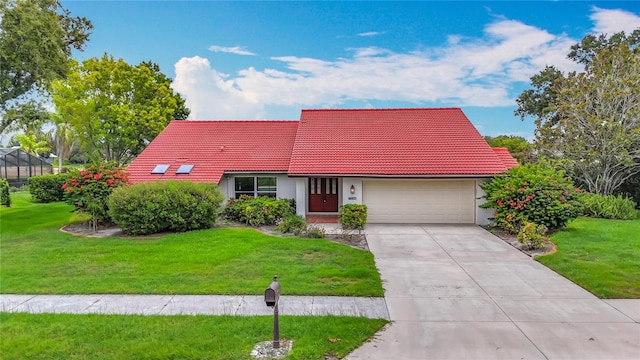 8822 Misty Creek Dr, Sarasota, FL 34241 - view of front of property featuring a tile roof, driveway, an attached garage, and a front yard
