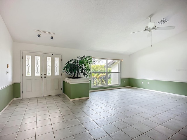 8822 Misty Creek Dr, Sarasota, FL 34241 - tiled entrance foyer featuring a ceiling fan, baseboards, and rail lighting
