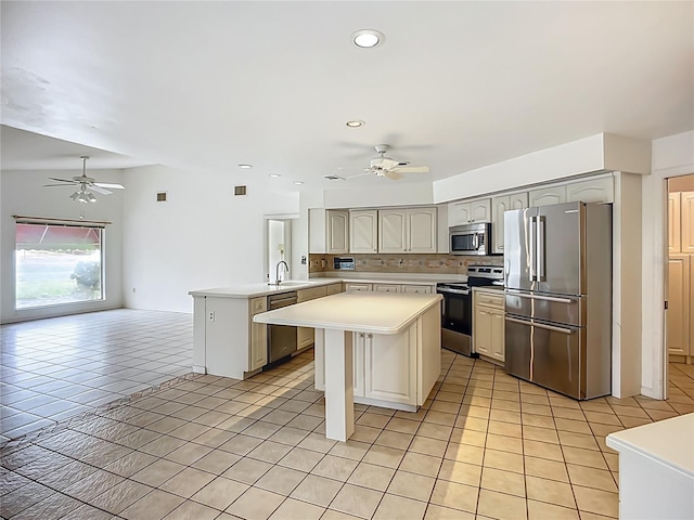 8822 Misty Creek Dr, Sarasota, FL 34241 - kitchen featuring stainless steel appliances, ceiling fan, light tile patterned floors, a peninsula, and recessed lighting