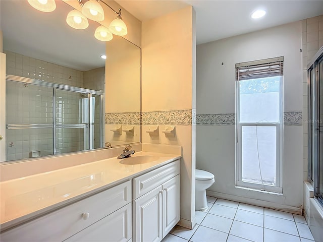 8822 Misty Creek Dr, Sarasota, FL 34241 - full bathroom with toilet, tile patterned floors, vanity, recessed lighting, and wainscoting