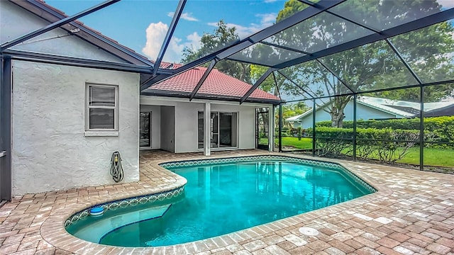 8822 Misty Creek Dr, Sarasota, FL 34241 - outdoor pool featuring a patio area and glass enclosure