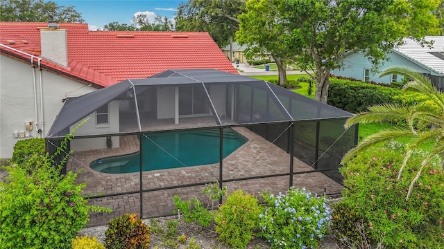 8822 Misty Creek Dr, Sarasota, FL 34241 - outdoor pool with glass enclosure and a patio