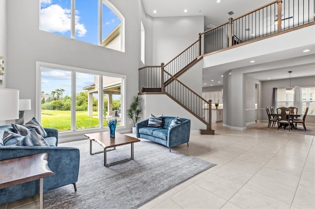 2724 Coco Palm Cir, Wesley Chapel, FL 33543 - tiled living room featuring a high ceiling, stairs, and recessed lighting