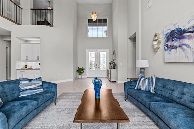 2724 Coco Palm Cir, Wesley Chapel, FL 33543 - living area featuring a high ceiling, light tile patterned floors, and french doors