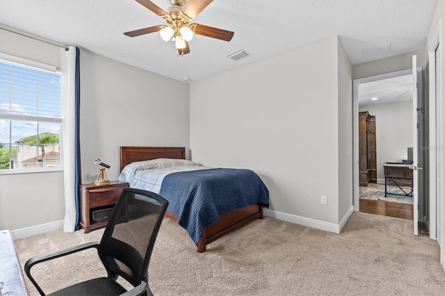 2724 Coco Palm Cir, Wesley Chapel, FL 33543 - bedroom with light colored carpet and a ceiling fan