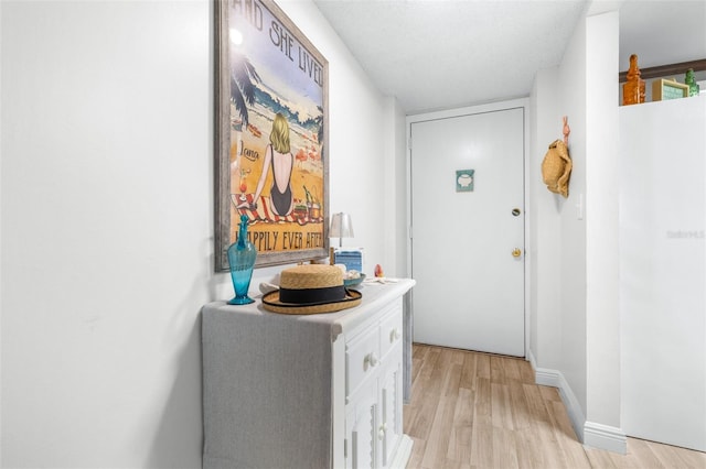 2060 Marilyn St Unit 114, Clearwater, FL 33765 - entryway with light wood-type flooring and baseboards