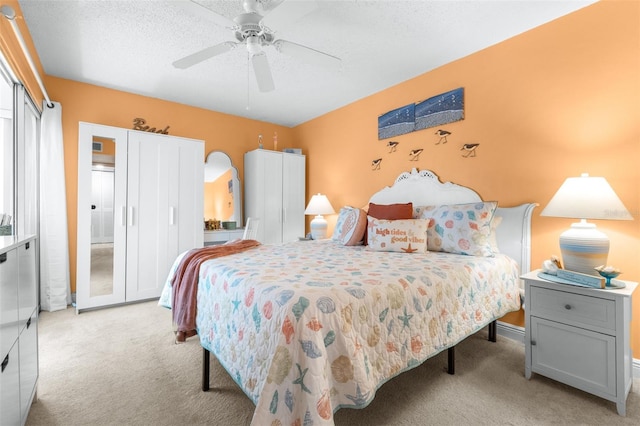 2060 Marilyn St Unit 114, Clearwater, FL 33765 - bedroom featuring light colored carpet, a ceiling fan, baseboards, and a textured ceiling