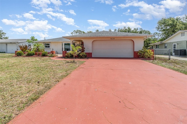 1839 Neptune Dr, Englewood, FL 34223 - single story home featuring stucco siding, central AC unit, an attached garage, and concrete driveway