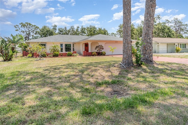 1839 Neptune Dr, Englewood, FL 34223 - ranch-style house featuring a garage, concrete driveway, stucco siding, and a front yard