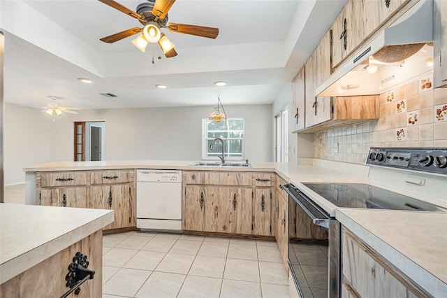 1839 Neptune Dr, Englewood, FL 34223 - kitchen with white dishwasher, electric stove, a sink, light countertops, and recessed lighting