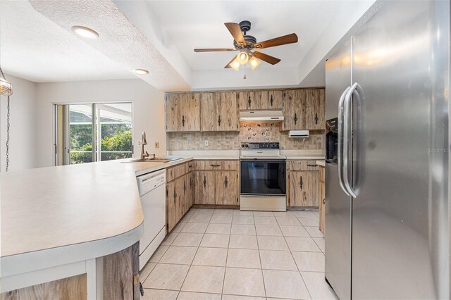 1839 Neptune Dr, Englewood, FL 34223 - kitchen with stainless steel fridge with ice dispenser, range with electric cooktop, a sink, dishwasher, and under cabinet range hood