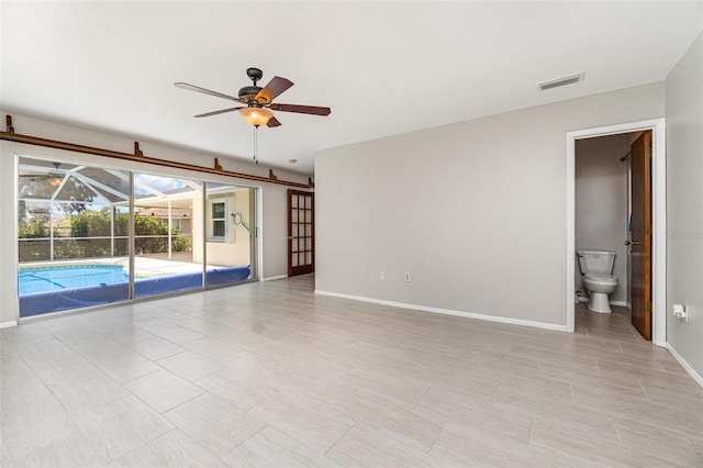 1839 Neptune Dr, Englewood, FL 34223 - empty room featuring ceiling fan, baseboards, and a sunroom