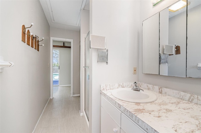 1839 Neptune Dr, Englewood, FL 34223 - full bath with vanity, baseboards, and a shower with door