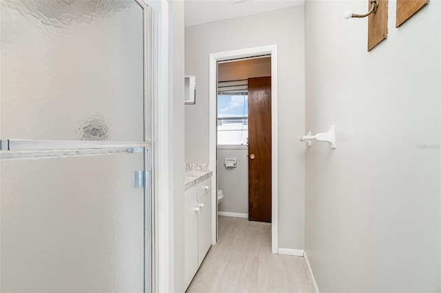 1839 Neptune Dr, Englewood, FL 34223 - full bathroom with a shower stall, toilet, vanity, and baseboards