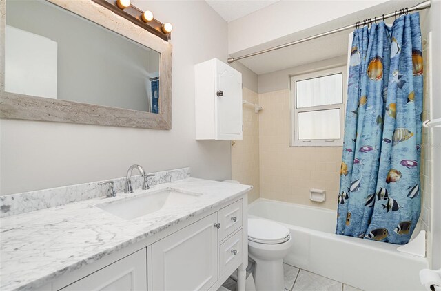 1839 Neptune Dr, Englewood, FL 34223 - bathroom featuring vanity, shower / bath combo, toilet, and tile patterned flooring
