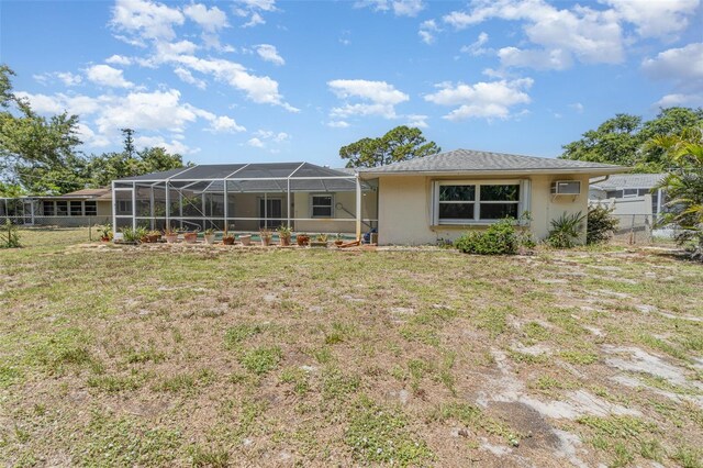 1839 Neptune Dr, Englewood, FL 34223 - back of house featuring stucco siding and a lanai