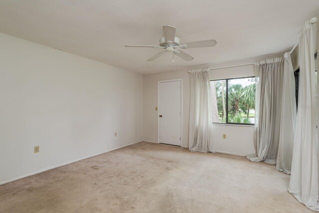 210 Martha Ln Unit 210, Oldsmar, FL 34677 - unfurnished room featuring ceiling fan, light colored carpet, and baseboards