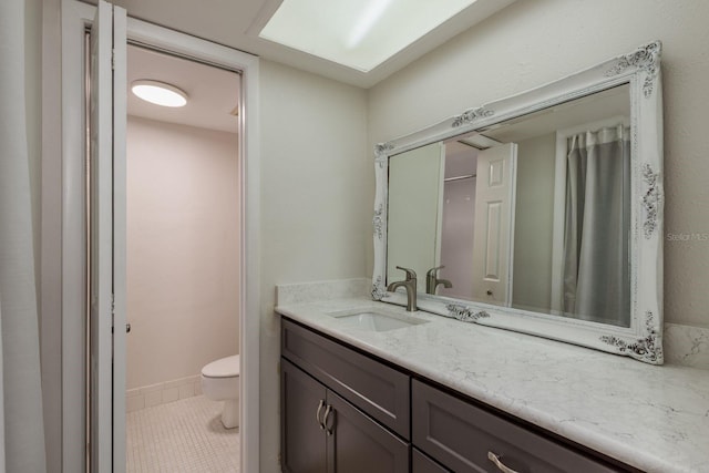 210 Martha Ln Unit 210, Oldsmar, FL 34677 - bathroom with vanity, toilet, and tile patterned flooring