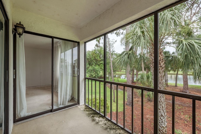 210 Martha Ln Unit 210, Oldsmar, FL 34677 - unfurnished sunroom featuring a water view