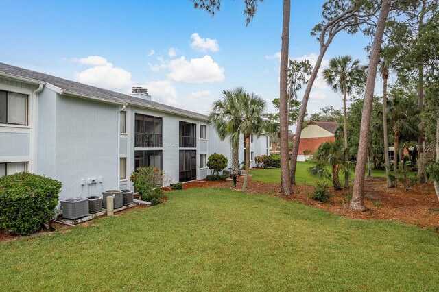 210 Martha Ln Unit 210, Oldsmar, FL 34677 - view of grassy yard featuring cooling unit