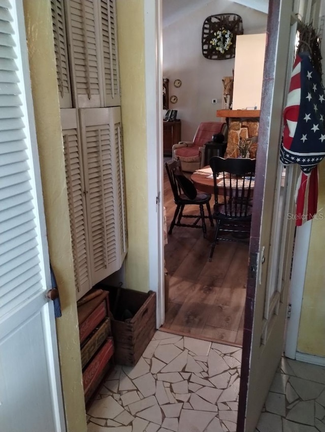 7608 Chenkin, Zephyrhills, FL 33540 - hallway featuring lofted ceiling and light wood finished floors