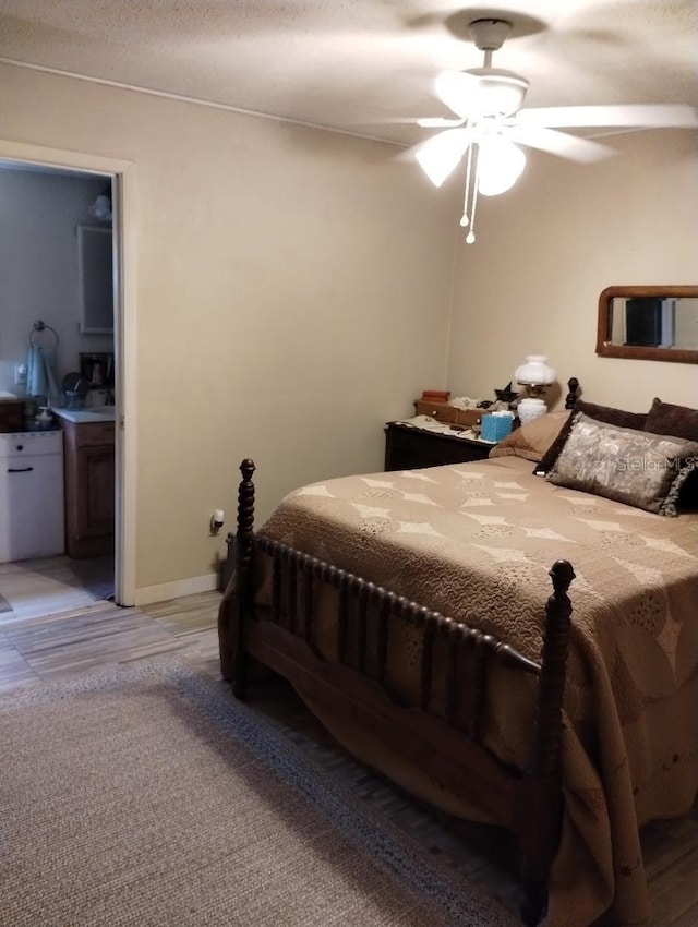 7608 Chenkin, Zephyrhills, FL 33540 - bedroom with ensuite bathroom, a ceiling fan, and baseboards