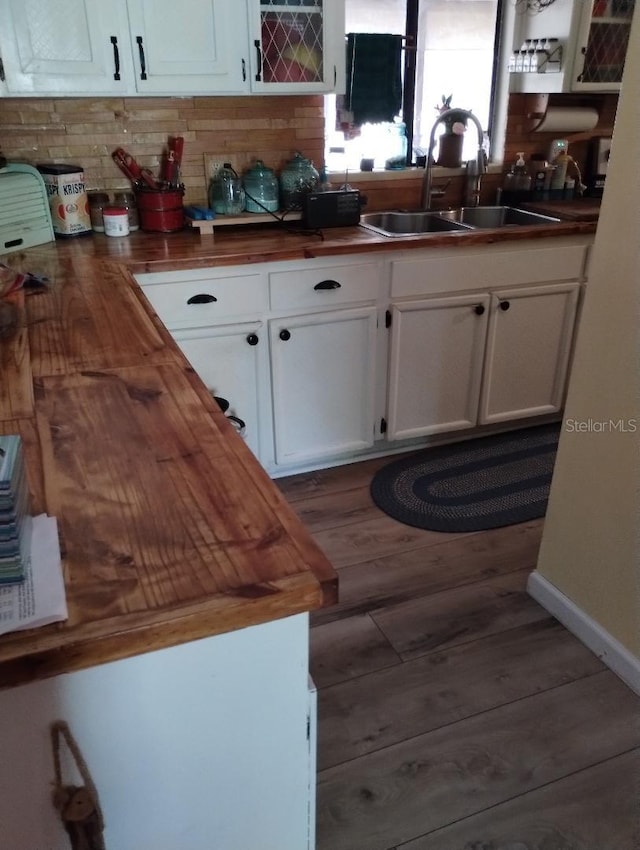 7608 Chenkin, Zephyrhills, FL 33540 - kitchen with butcher block countertops, a sink, dark wood-type flooring, and white cabinetry