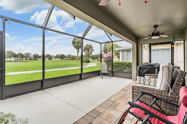 10232 Buncombe Way, San Antonio, FL 33576 - sunroom with a ceiling fan and view of golf course