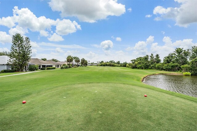 10232 Buncombe Way, San Antonio, FL 33576 - view of community featuring golf course view, a water view, and a lawn