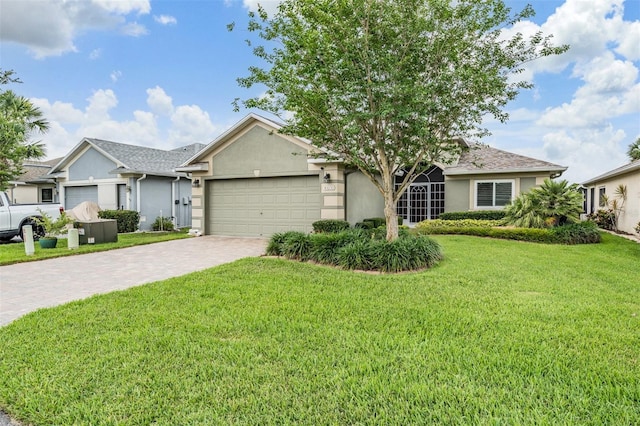 10232 Buncombe Way, San Antonio, FL 33576 - ranch-style home with decorative driveway, stucco siding, an attached garage, and a front yard