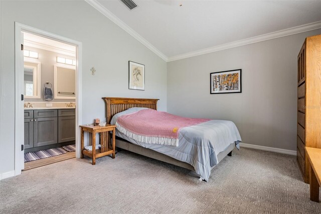 10232 Buncombe Way, San Antonio, FL 33576 - bedroom featuring crown molding, carpet, lofted ceiling, connected bathroom, and baseboards