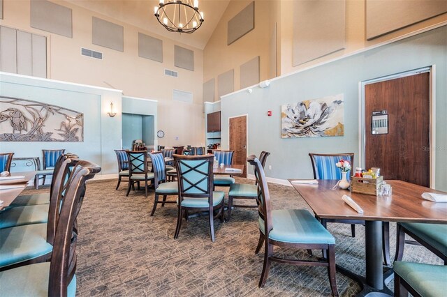 10232 Buncombe Way, San Antonio, FL 33576 - carpeted dining room with a chandelier, high vaulted ceiling, and baseboards