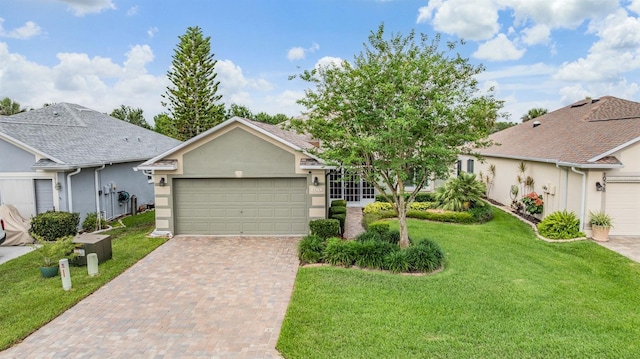 10232 Buncombe Way, San Antonio, FL 33576 - ranch-style home with decorative driveway, a front yard, stucco siding, and an attached garage