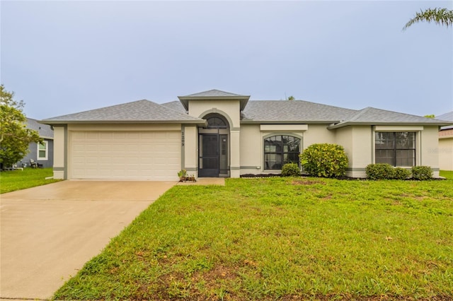 1209 Sugar Creek Ln, Rockledge, FL 32955 - view of front of house with stucco siding, an attached garage, a front yard, and concrete driveway