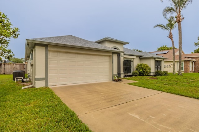 1209 Sugar Creek Ln, Rockledge, FL 32955 - view of front facade featuring central AC, driveway, an attached garage, and stucco siding