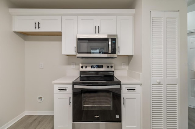 1209 Sugar Creek Ln, Rockledge, FL 32955 - kitchen with appliances with stainless steel finishes, light countertops, light wood-style floors, and baseboards