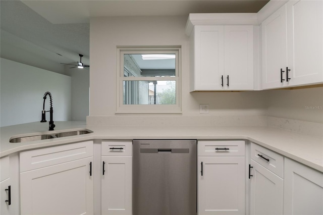 1209 Sugar Creek Ln, Rockledge, FL 32955 - kitchen with stainless steel dishwasher, a sink, white cabinetry, and light countertops