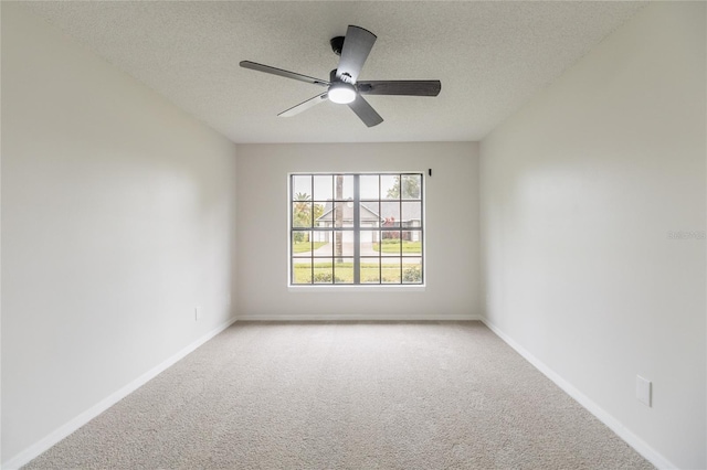 1209 Sugar Creek Ln, Rockledge, FL 32955 - unfurnished room featuring light colored carpet, a textured ceiling, a ceiling fan, and baseboards