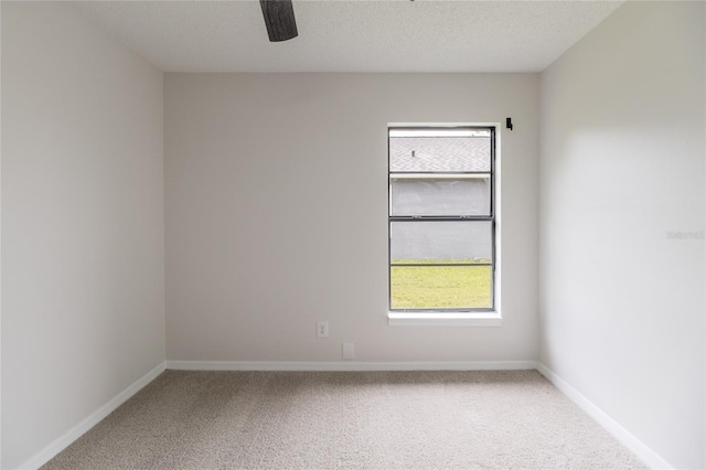 1209 Sugar Creek Ln, Rockledge, FL 32955 - empty room featuring carpet floors, a ceiling fan, baseboards, and a textured ceiling