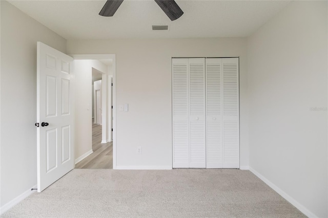 1209 Sugar Creek Ln, Rockledge, FL 32955 - unfurnished bedroom with light colored carpet, a closet, baseboards, and ceiling fan